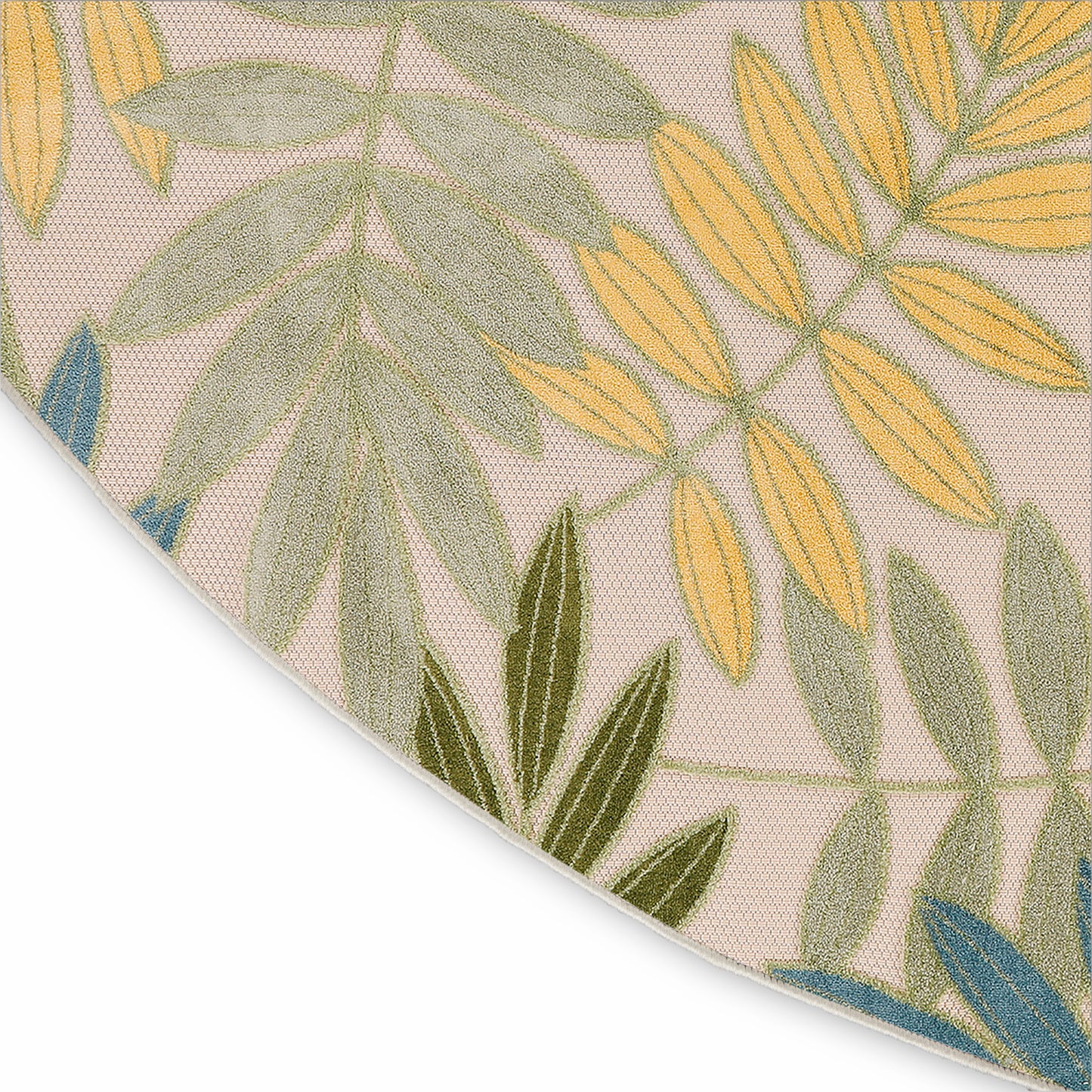 Round beige woven rug with tropical leaf pattern in green, yellow and blue; textured casual coastal style.
