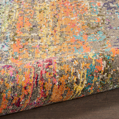 Close-up of a vibrant multicolor shag rug with chunky pile and abstract pattern, rolled edge on dark wooden floor.