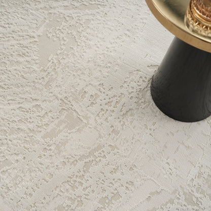 Beige textured damask rug.