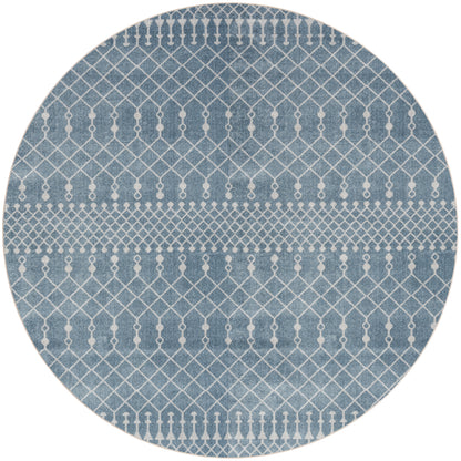 Round blue rug with white geometric lattice and dot pattern, denim-inspired texture; modern coastal decor