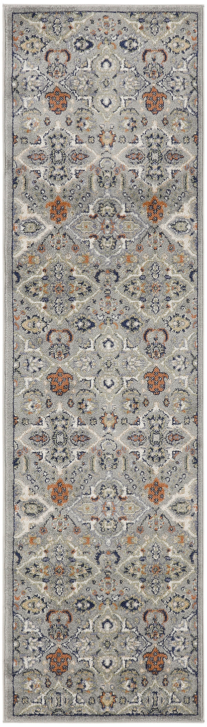 Long Persian-style runner rug in gray-blue with ivory, navy and rust floral motifs; distressed pile for hallway decor.