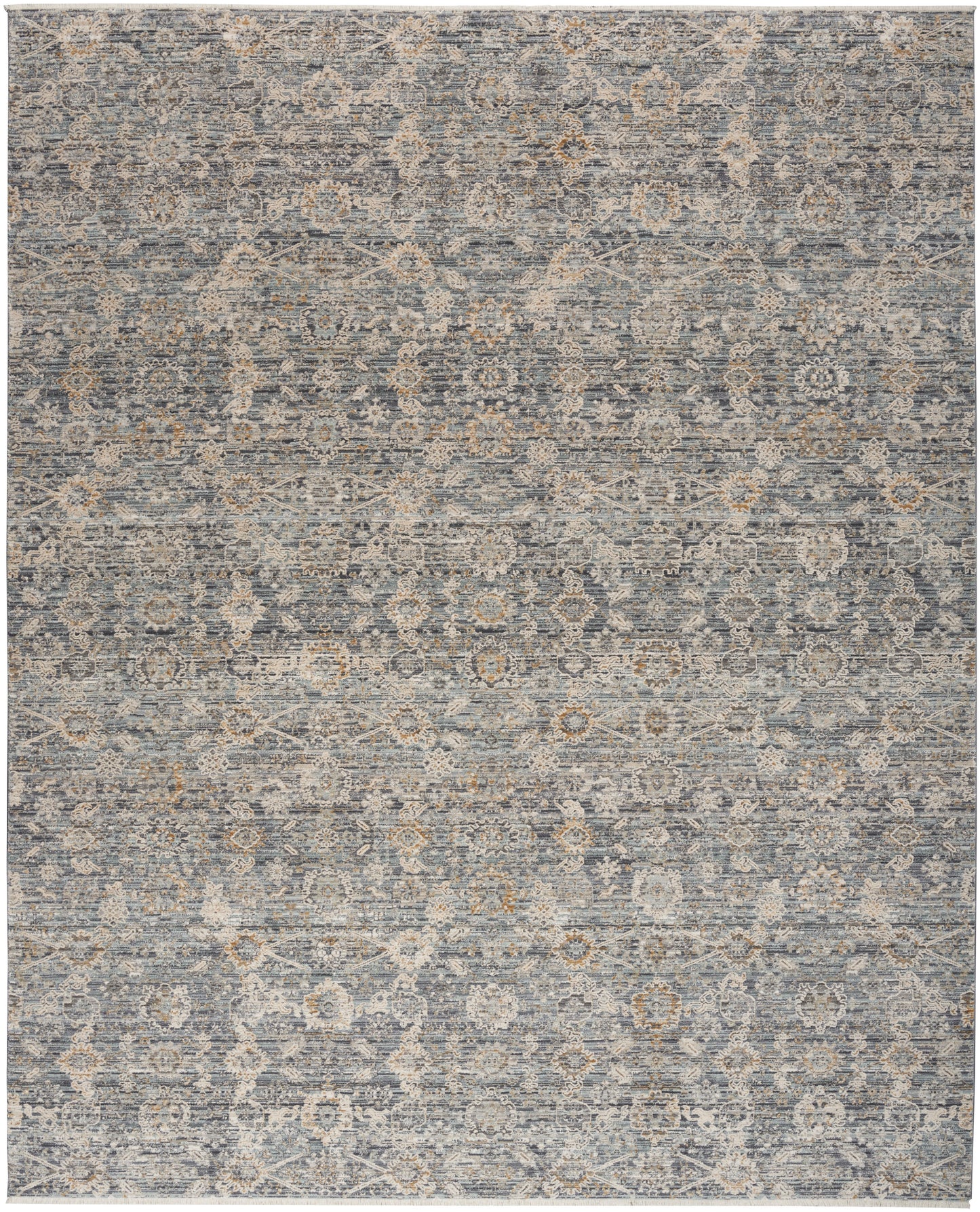 Distressed blue-gray oriental rug with faded beige floral medallion pattern; versatile for living room decor.