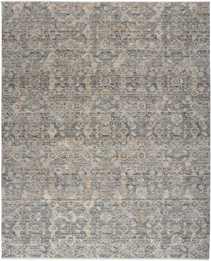 Distressed blue-gray oriental rug with faded beige floral medallion pattern; versatile for living room decor.