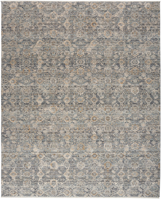 Distressed blue-gray oriental rug with faded beige floral medallion pattern; versatile for living room decor.