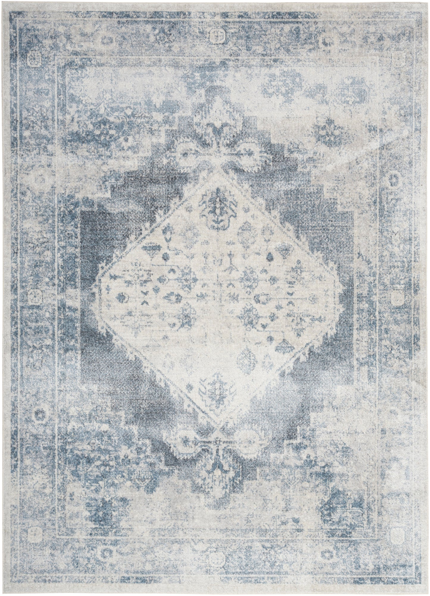 Distressed blue and ivory oriental rug with a central diamond medallion and ornate border, vintage style.