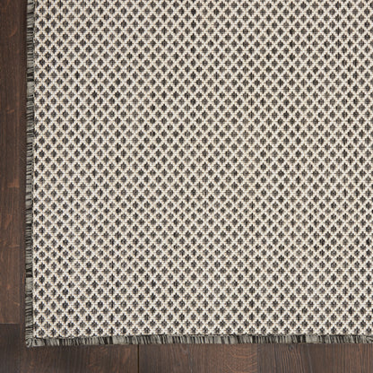 Beige gradient rectangular rug with dark wood edge and cream geometric border along the left, rustic-modern.