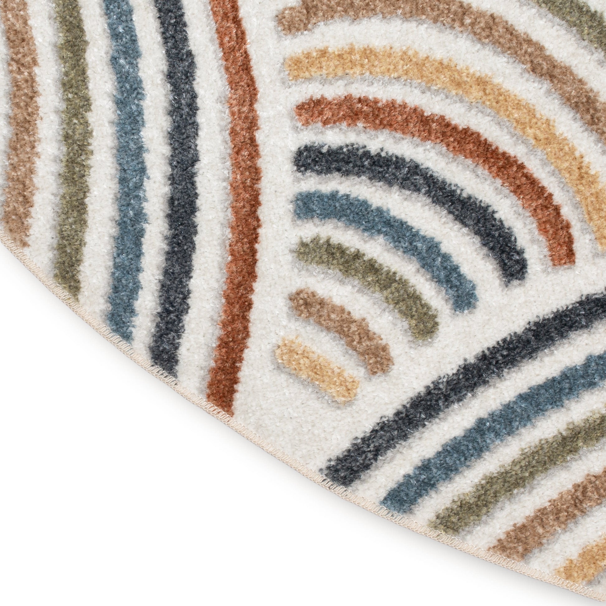 Shaggy area rug with multicolored curved stripes in olive, navy, rust, blue and tan; corner fold shows ivory background.