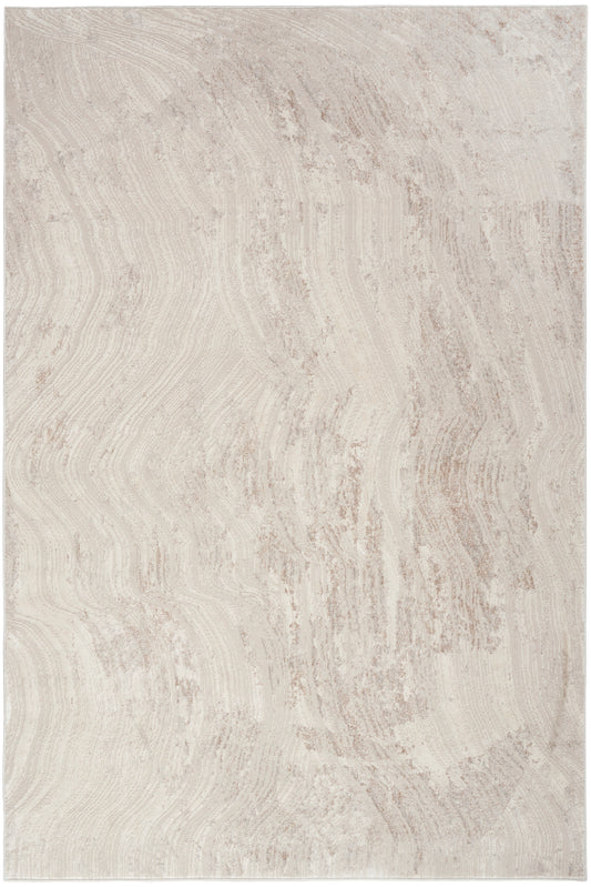 Beige cream abstract patterned area rug with soft plush pile and wavy, wood-grain-like lines.