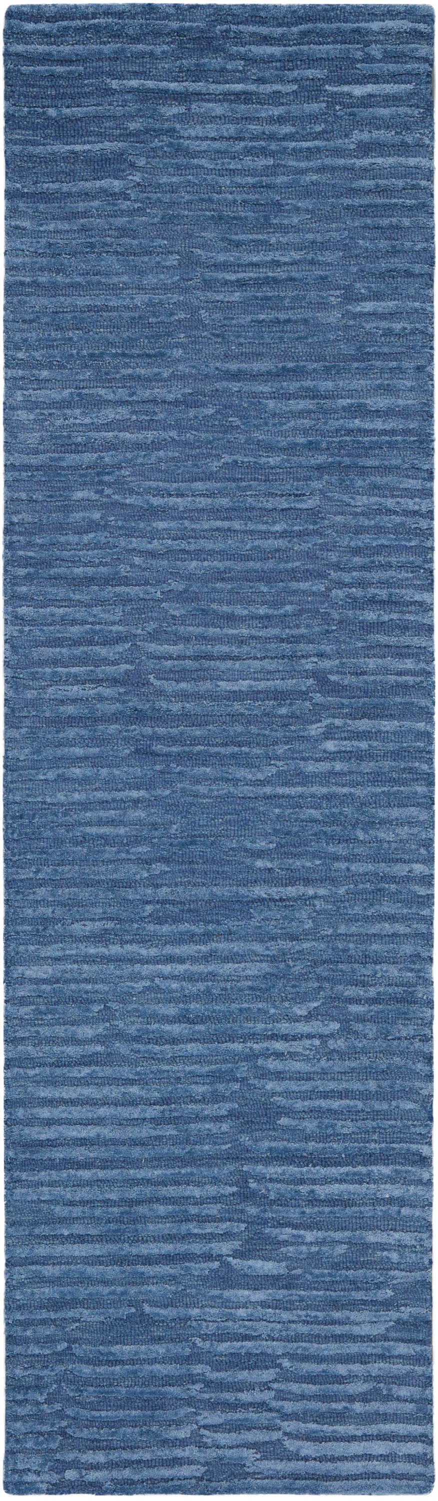 Blue textured shag runner rug with variegated blue tones and soft plush pile.