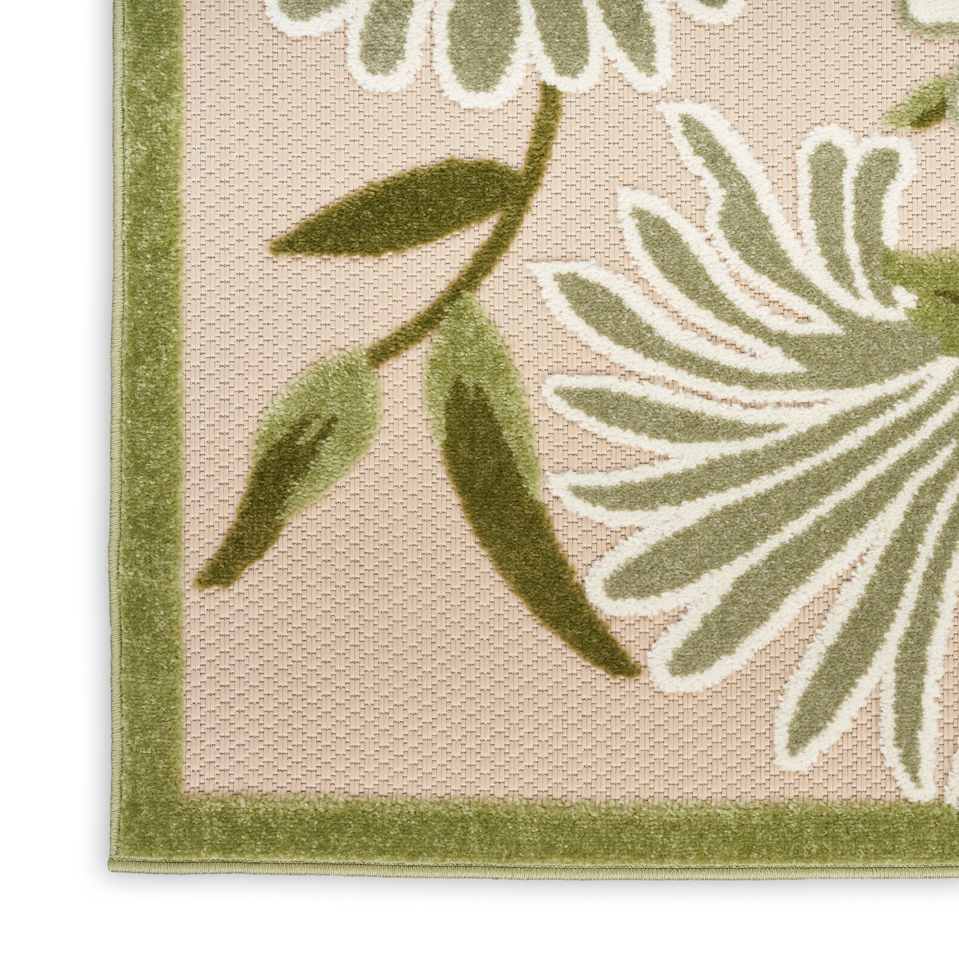 Beige outdoor rug 8' x 11' corner with sage-green border and large white-green botanical floral design, textured weave.