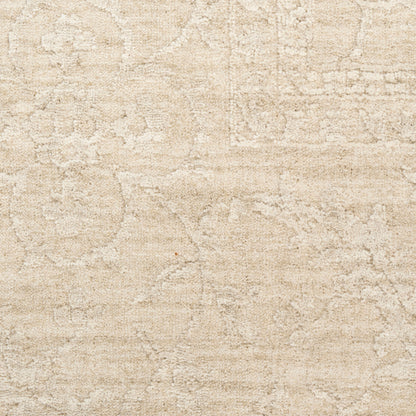 Beige area rug with subtle damask texture and plush, soft pile.