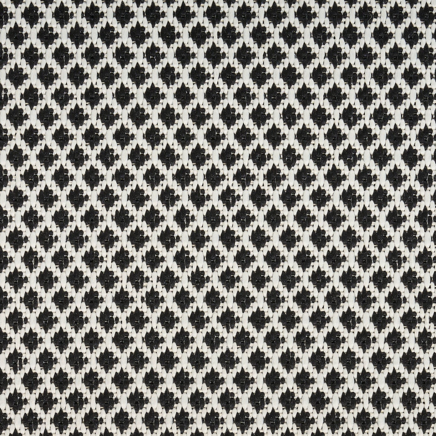 Black and white diamond lattice knit fabric with tight repeating diamonds.