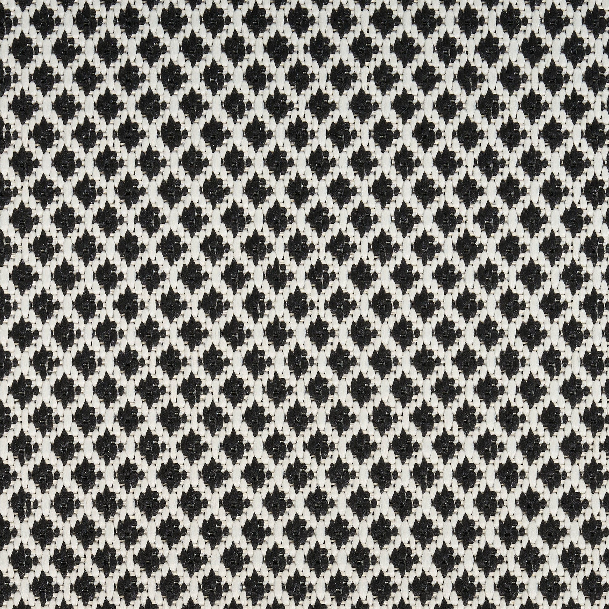 Black and white diamond lattice knit fabric with tight repeating diamonds.