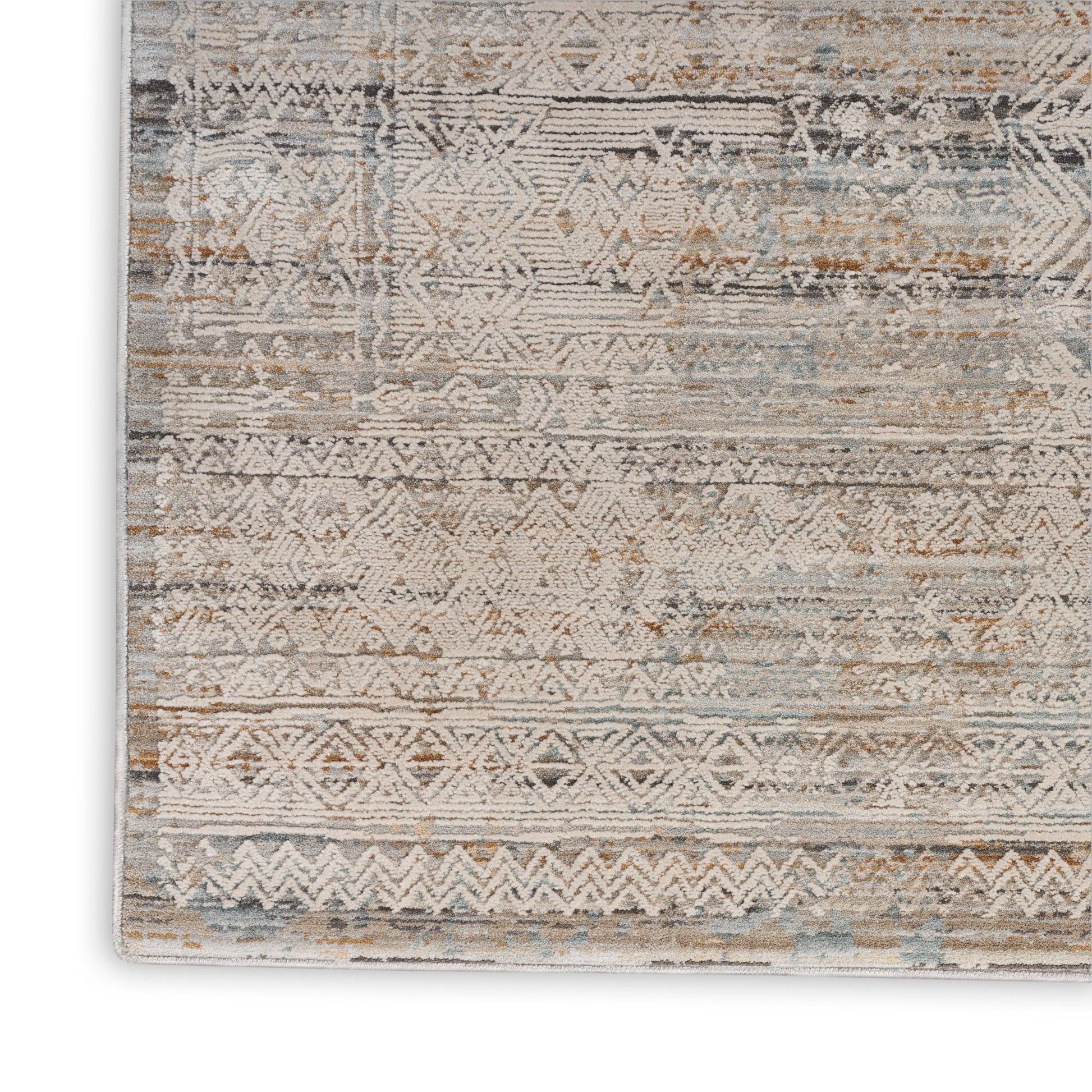 Distressed geometric runner rug in beige, tan, blue and gray with tribal motifs and a soft vintage look.
