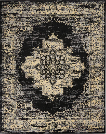 Distressed black and beige oriental area rug with a central medallion and ornate border.