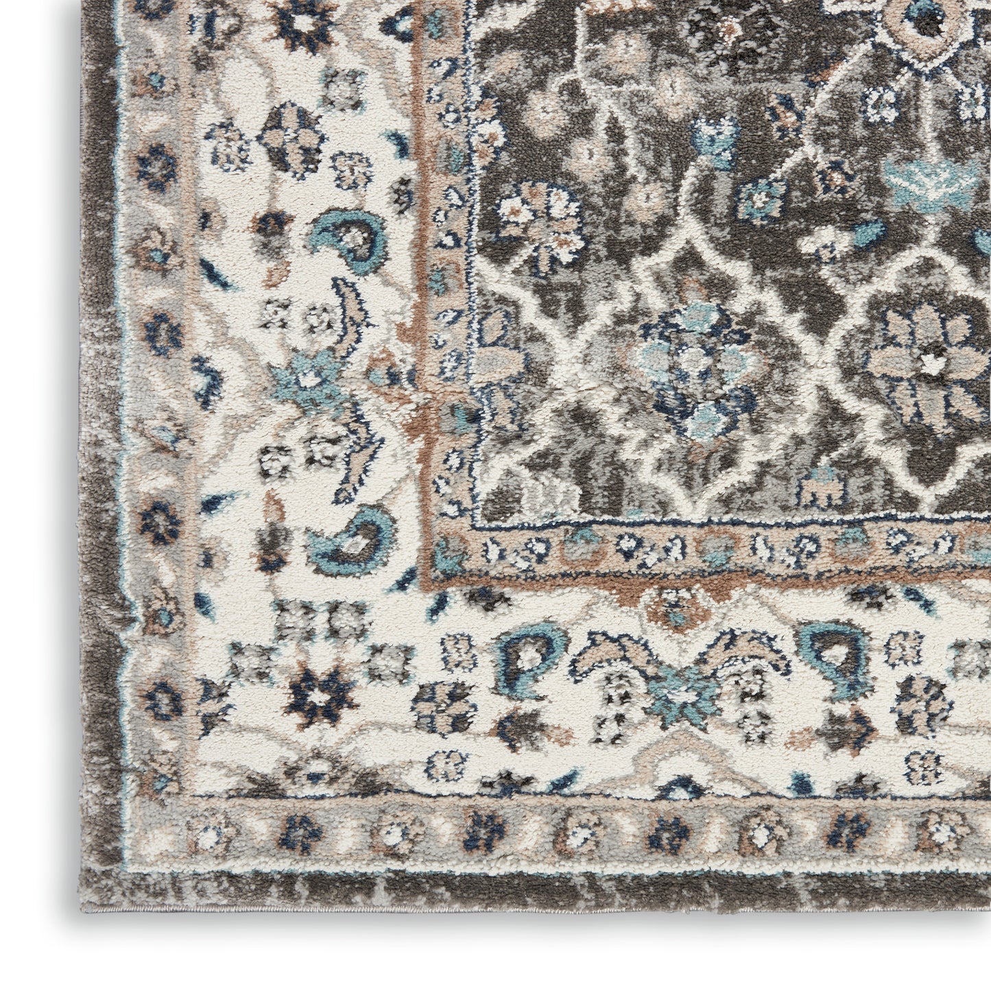 Rectangular vintage-style area rug with ivory base, blue and brown floral medallions and border, distressed low-pile weave.