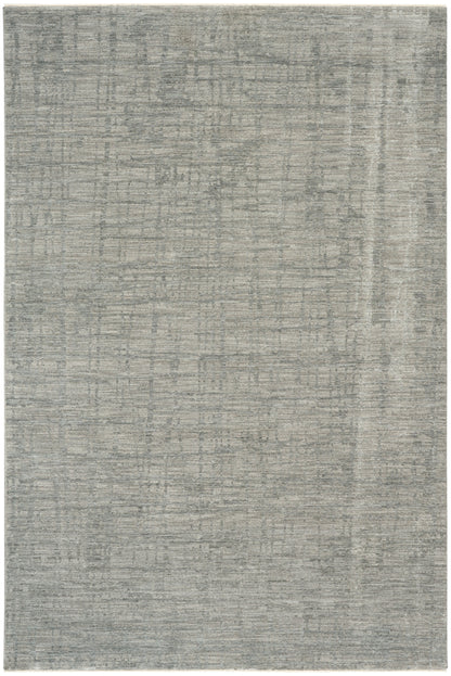 Rectangular grey distressed area rug with subtle weathered pattern in light and dark gray tones.