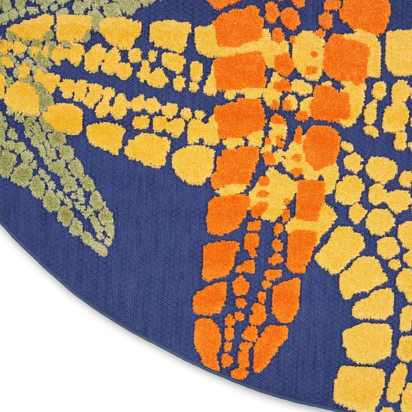 Blue woven round outdoor rug with orange and yellow mosaic spots forming a dragonfly wing motif.