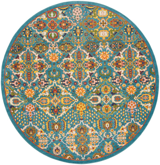 Round teal rug with a vibrant Persian-style floral pattern in orange, yellow, pink, white and blue; turquoise border.