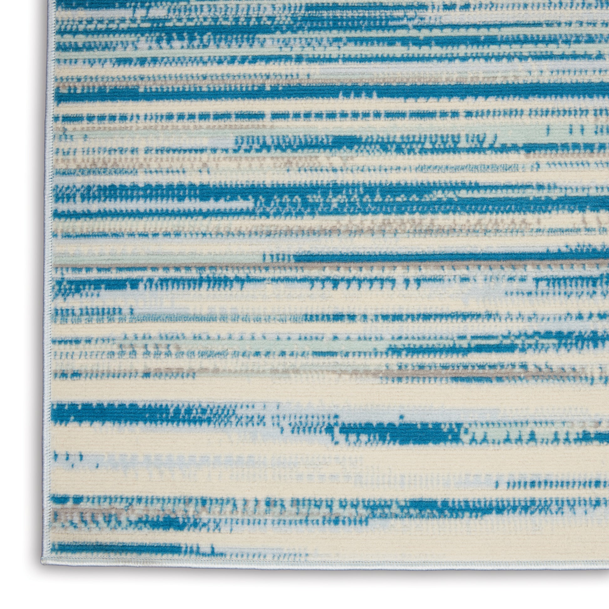 Abstract blue and cream horizontal striped wall art in a slim frame; modern coastal textile pattern.