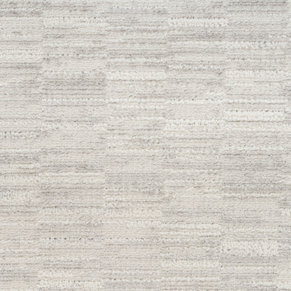 Cream and light gray textured rug with subtle stripe pattern; soft plush pile for the living room.
