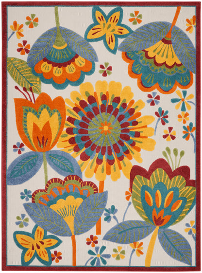 Colorful rectangular area rug with oversized florals in orange, yellow, teal, blue and green on cream, framed by red border.