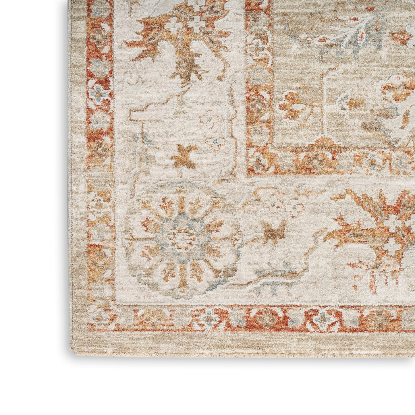 Cream oriental rug corner with rust border & blue floral medallion, soft textured pile for living room decor.