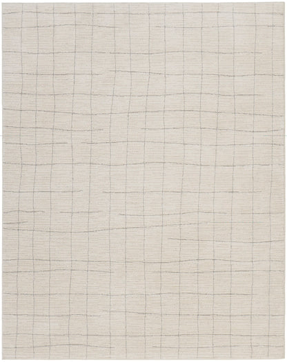 Cream woven rug with a subtle gray grid pattern forming square tiles; soft neutral floor covering.