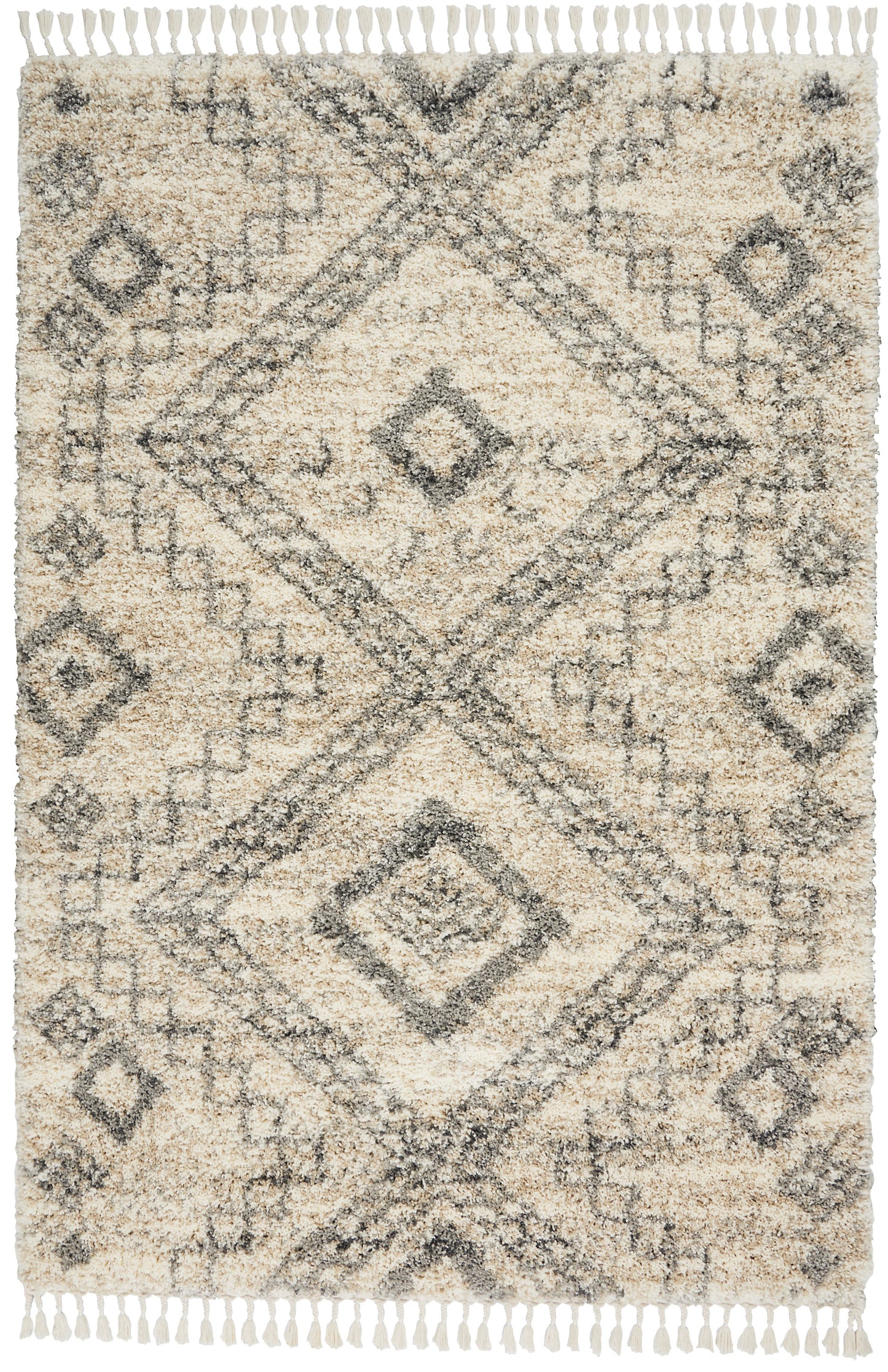Cream beige shag rug with a faded charcoal-gray geometric diamond motif and fringed edges.