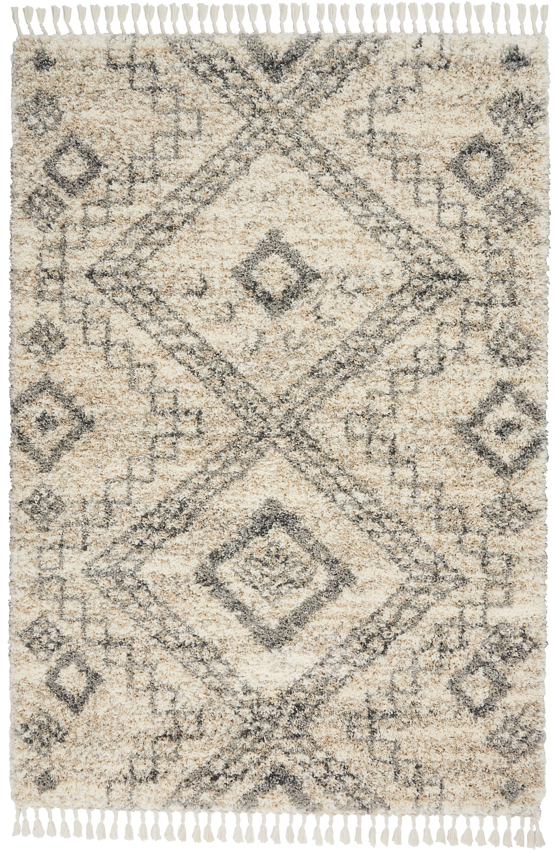 Cream beige shag rug with a faded charcoal-gray geometric diamond motif and fringed edges.