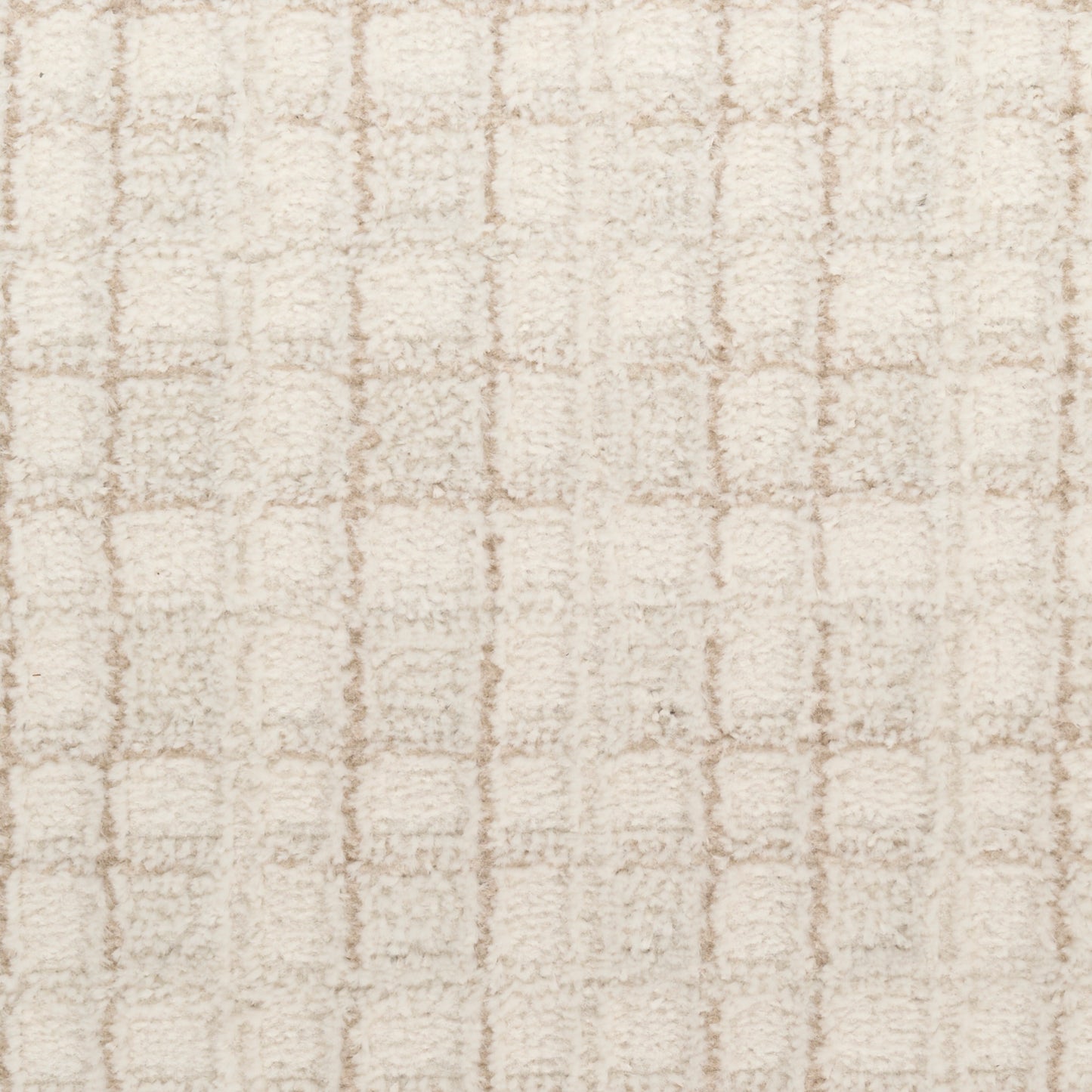 Beige shag rug with cream loop-pile and a subtle square grid pattern.