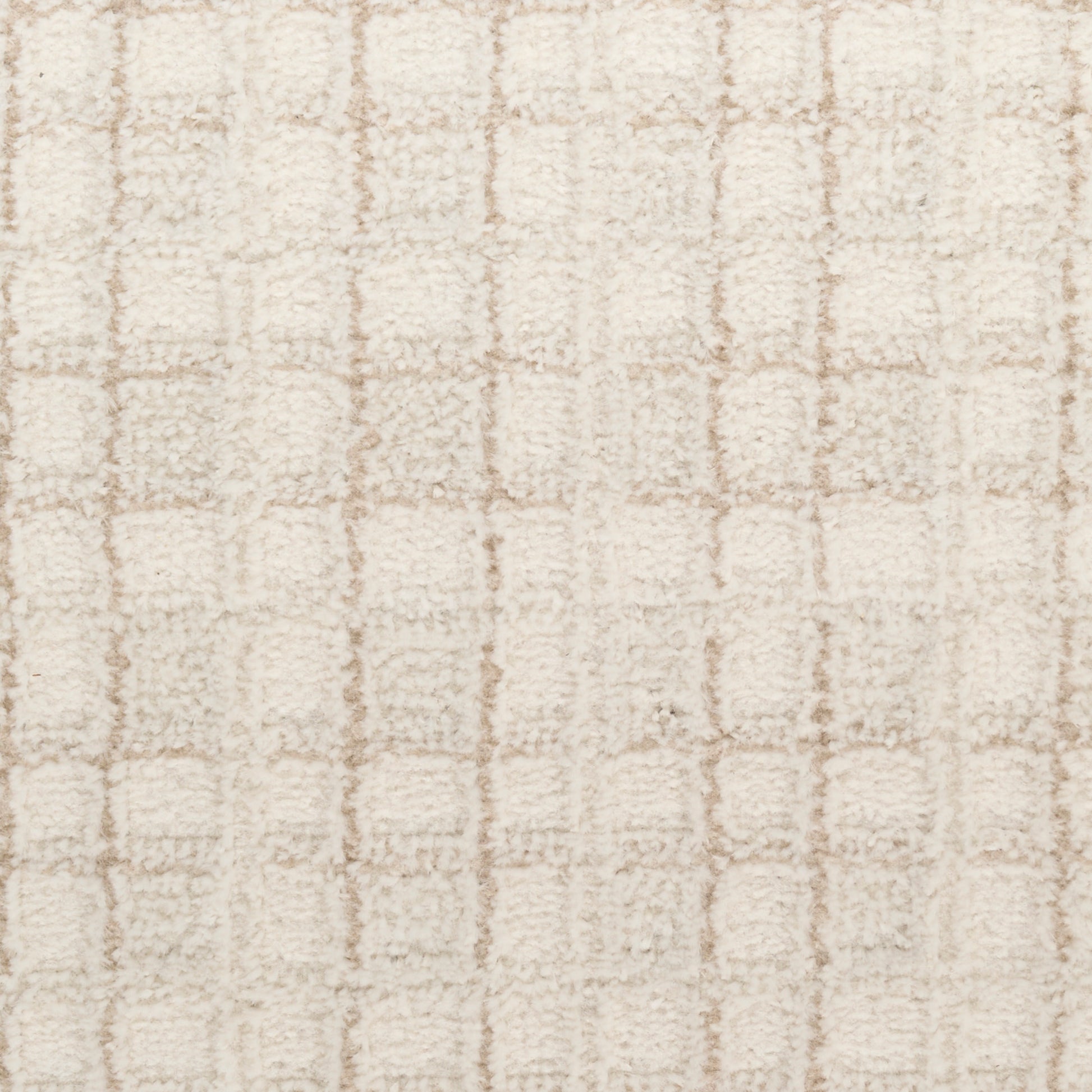 Beige shag rug with cream loop-pile and a subtle square grid pattern.