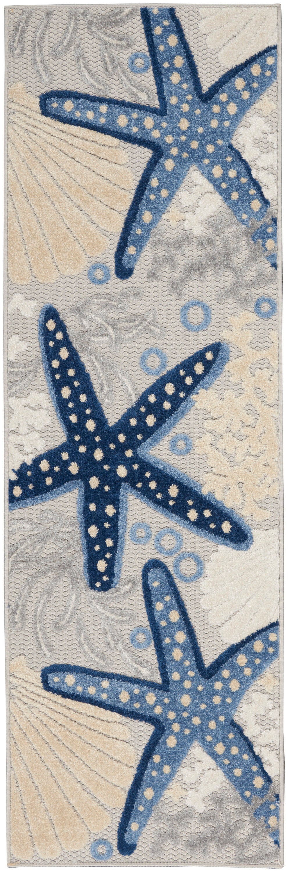 Coastal runner rug with navy starfish and pale seashells on beige-gray background; tufted nautical decor.