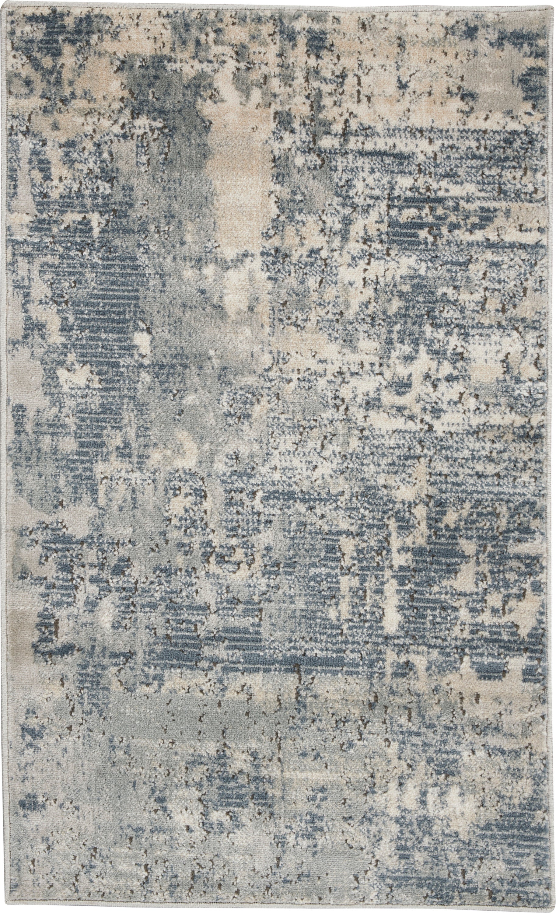 Rectangular rug with abstract distressed blue-gray pattern; soft pile, modern/contemporary style for living room.