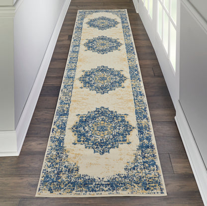 Long beige hallway runner rug with blue damask medallions and blue border on dark wood floor.