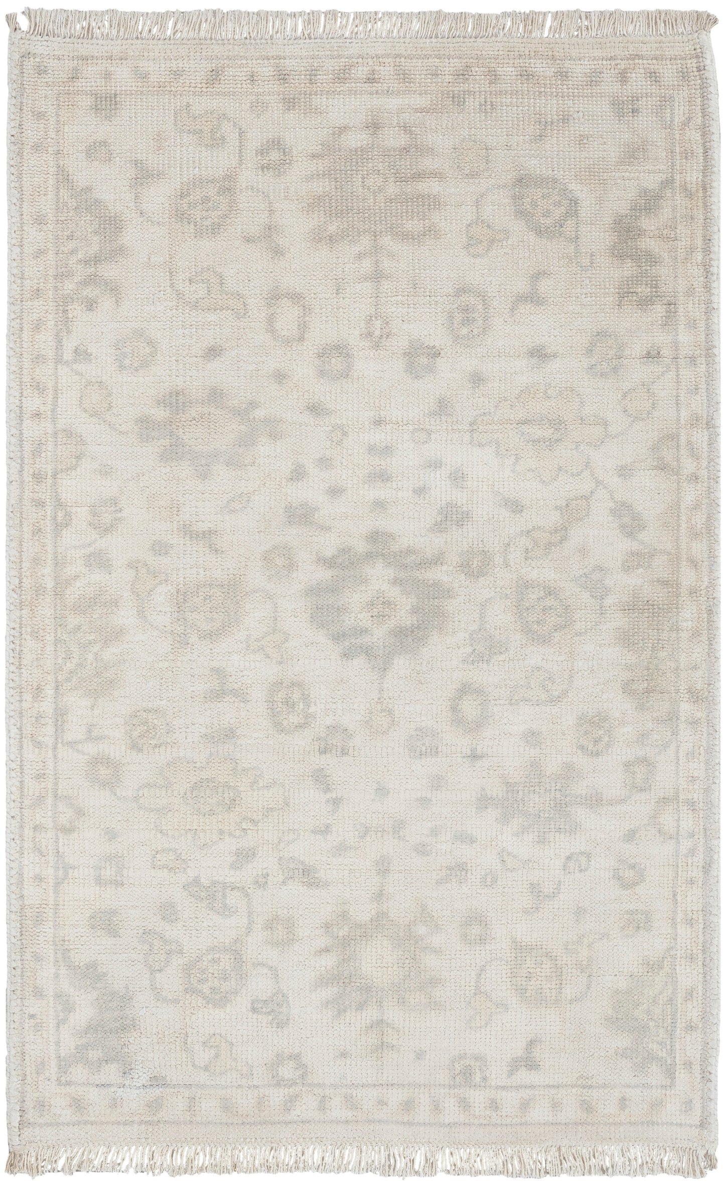 Cream Persian-style area rug with pale grey floral medallion pattern and fringed edges.