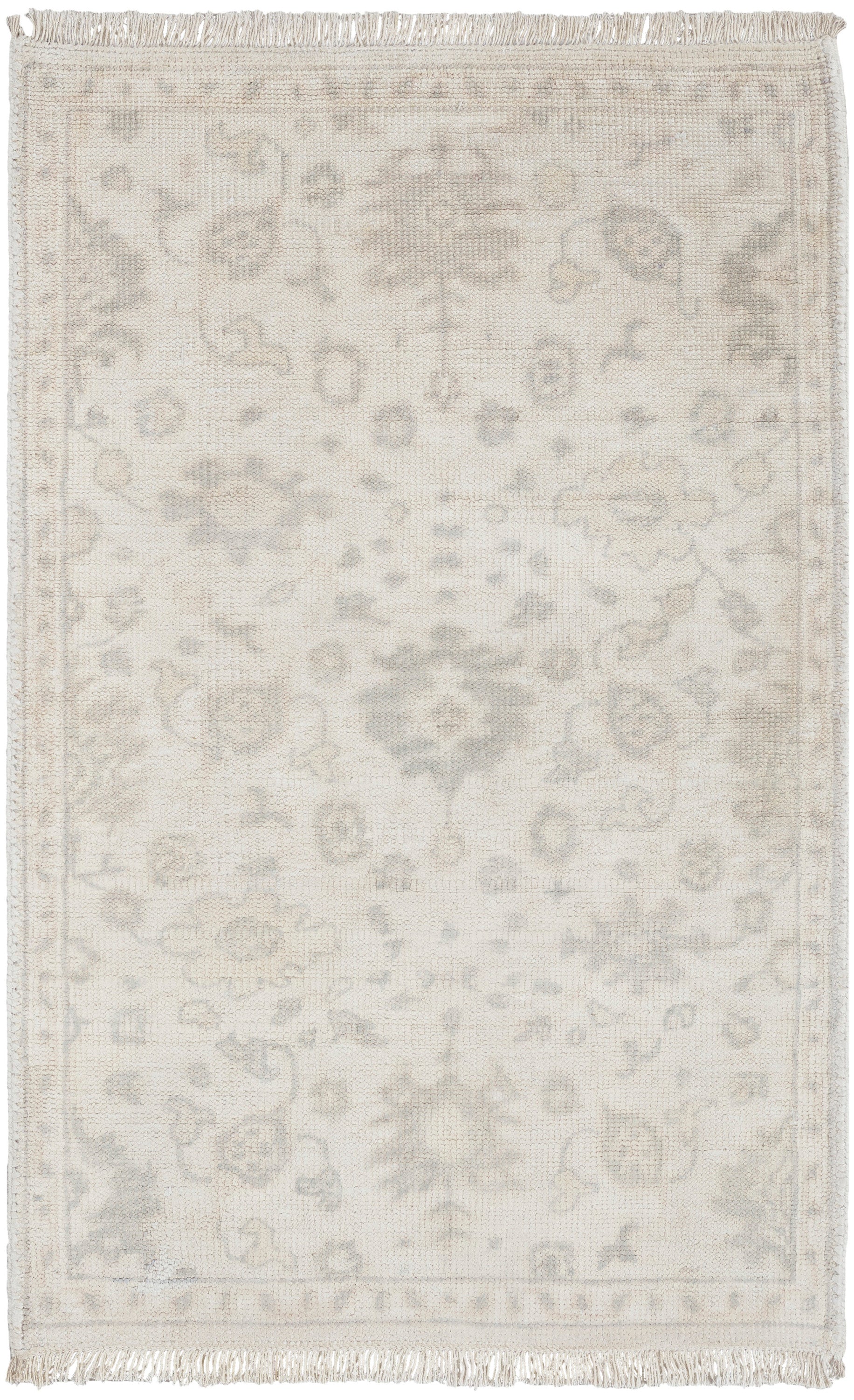Cream Persian-style area rug with pale grey floral medallion pattern and fringed edges.
