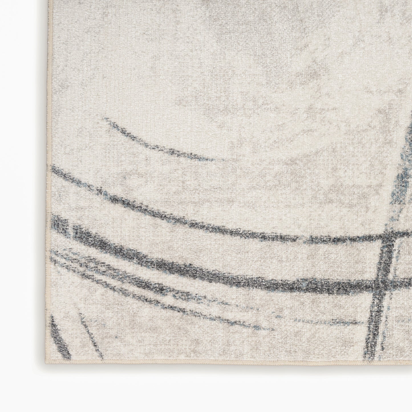Beige textured rug corner with dark gray abstract curved lines in a modern minimalist style.