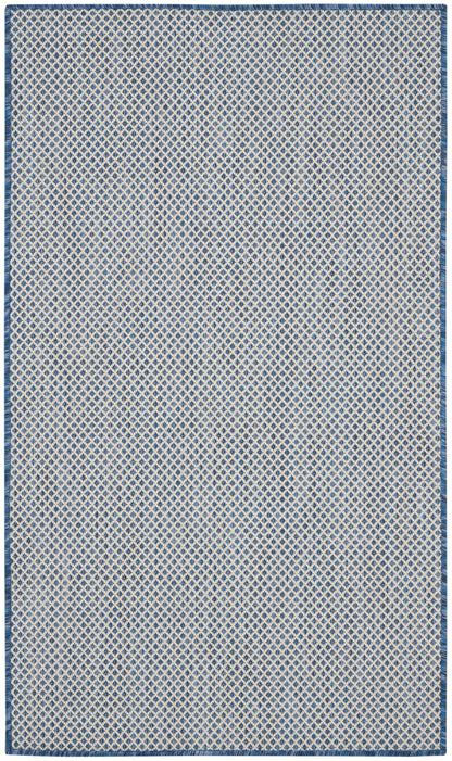 Rectangular blue and white diamond lattice rug with a dark blue border and fringe.