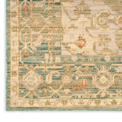 Distressed beige and teal oriental rug with blue border, cream field and ornate floral medallion pattern.