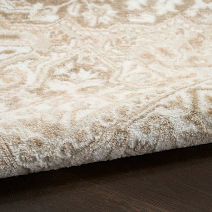 Cream and beige patterned high-pile shag rug on dark wood floor.
