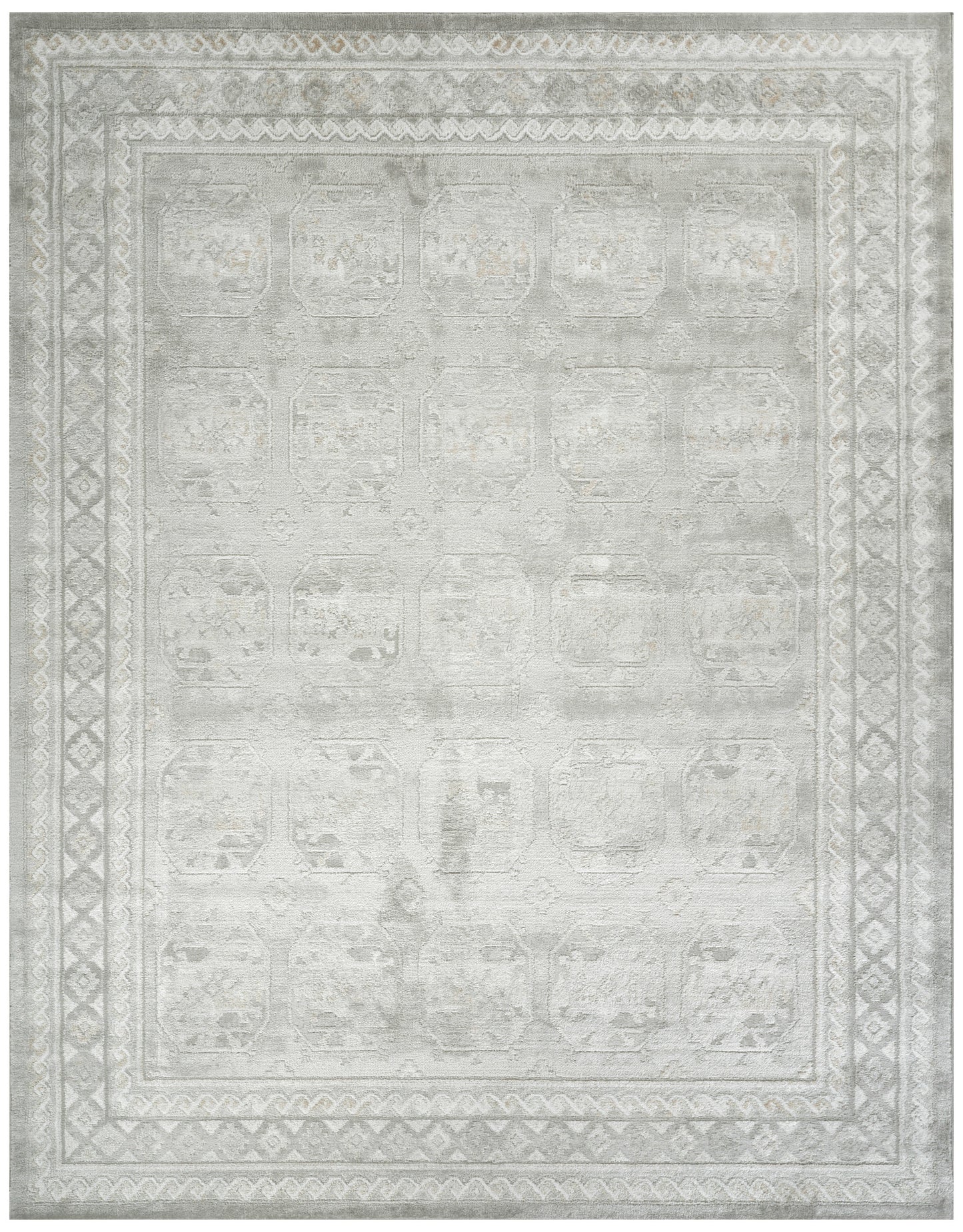 Rectangular light gray distressed rug with ivory geometric borders and faded medallion pattern; versatile oriental style.