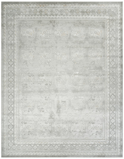 Rectangular light gray distressed rug with ivory geometric borders and faded medallion pattern; versatile oriental style.