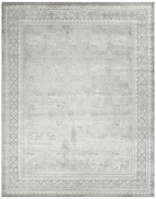 Rectangular light gray distressed rug with ivory geometric borders and faded medallion pattern; versatile oriental style.