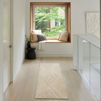 Bright hallway with a wooden-framed window seat, beige cushions, cream rug, white walls, glass railing; greenery outside