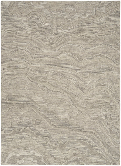 Beige rectangular area rug with subtle marble-like swirls and a soft, textured surface.