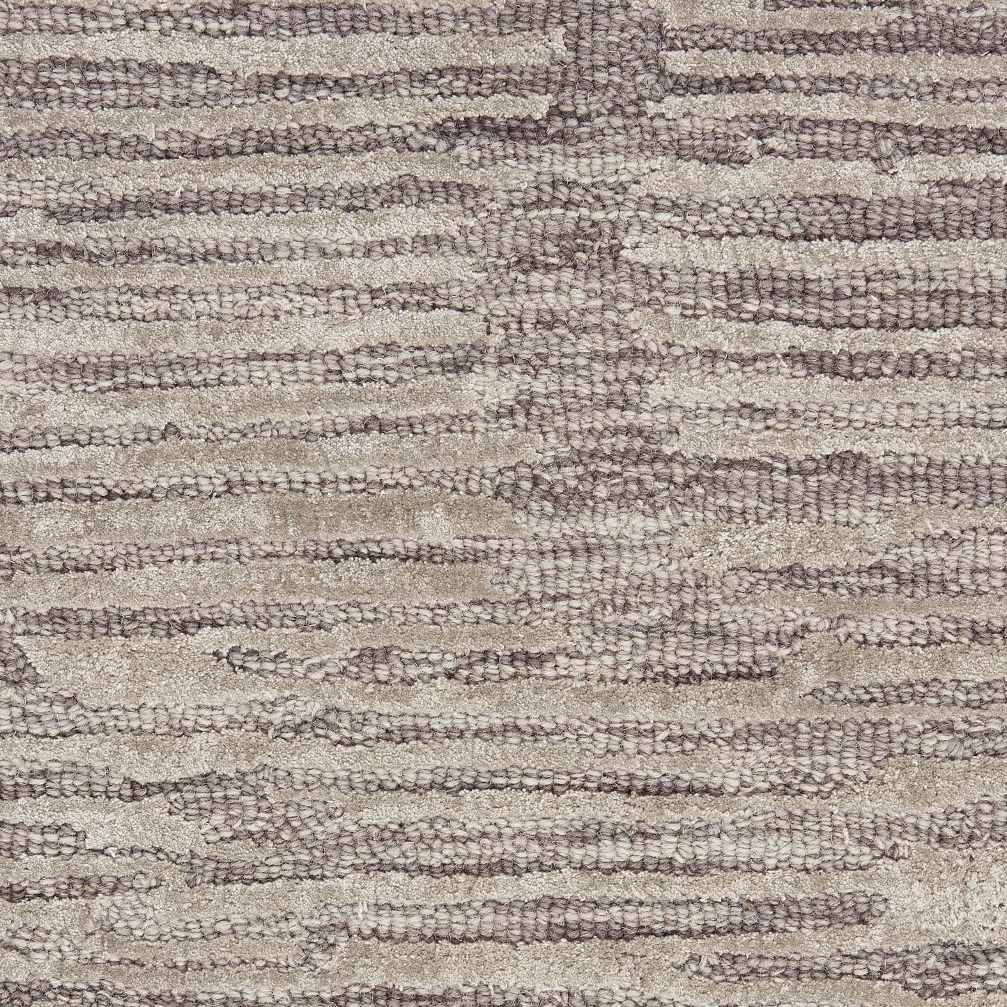 Beige and taupe striped woven rug with soft, textured looped pile and organic horizontal patterns.
