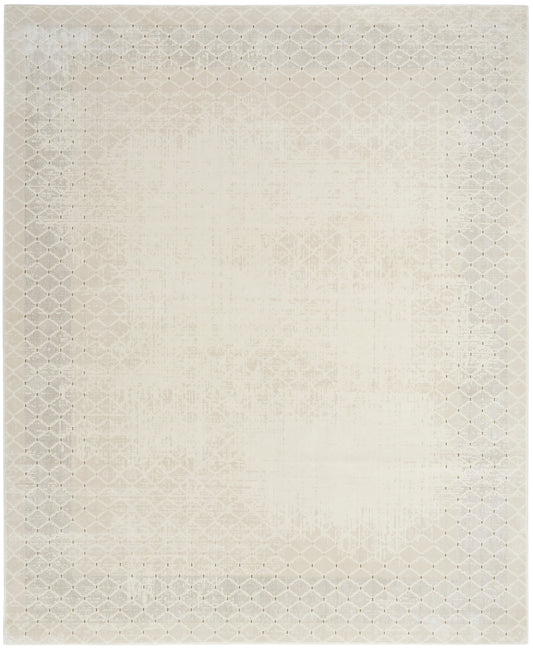 Cream rectangular rug with subtle distressed center and diamond lattice border; soft, neutral woven texture.