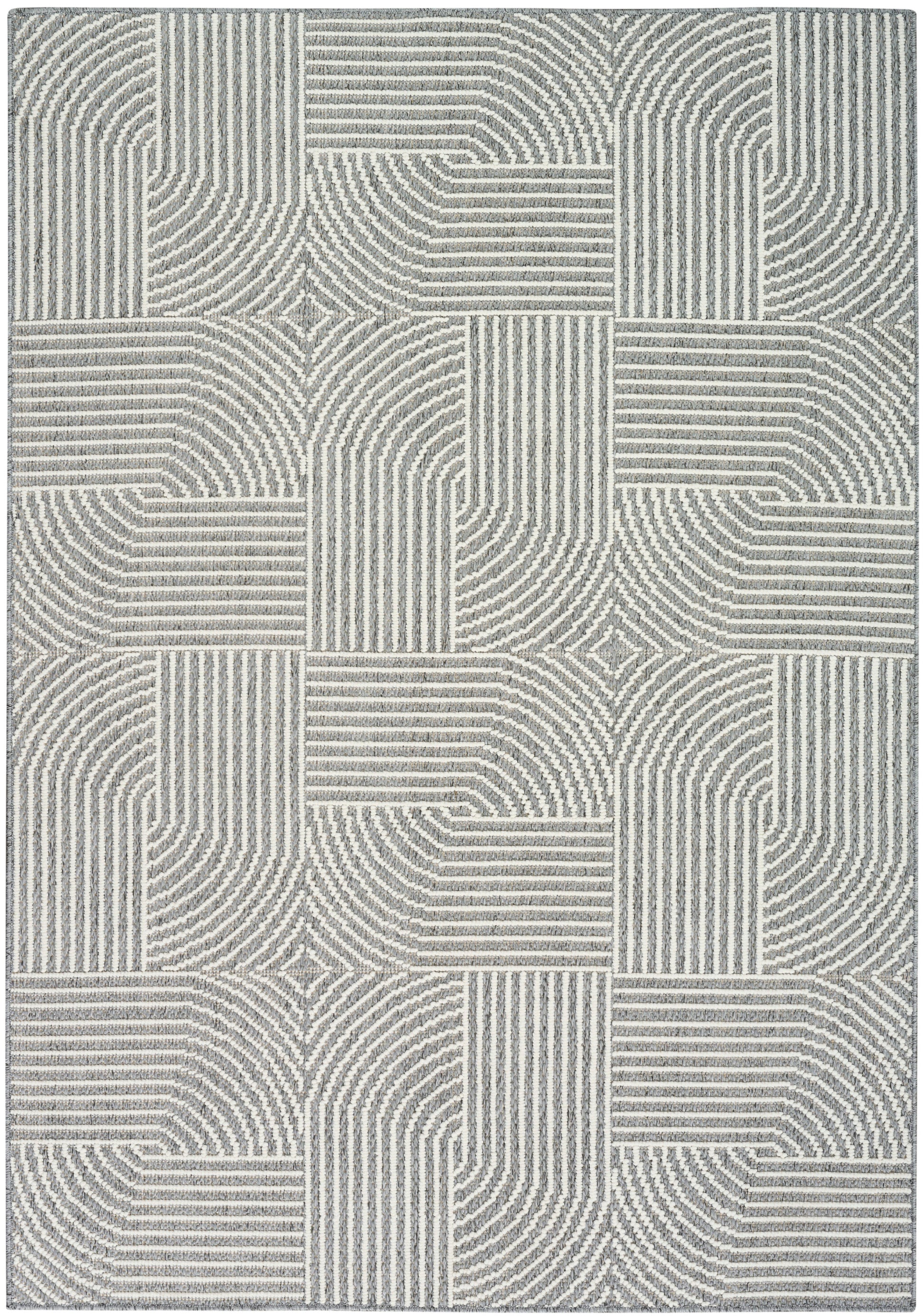 Gray and cream geometric area rug with patchwork blocks of striped and curved lines; textured loop pile.