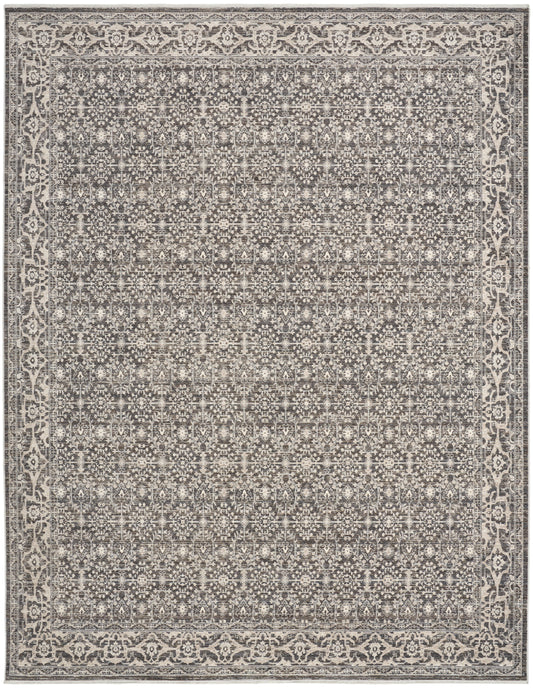 Gray and ivory rectangular area rug with dense geometric floral pattern and ornate border; vintage distressed look.